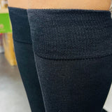 Close-up of black knee high sock knit