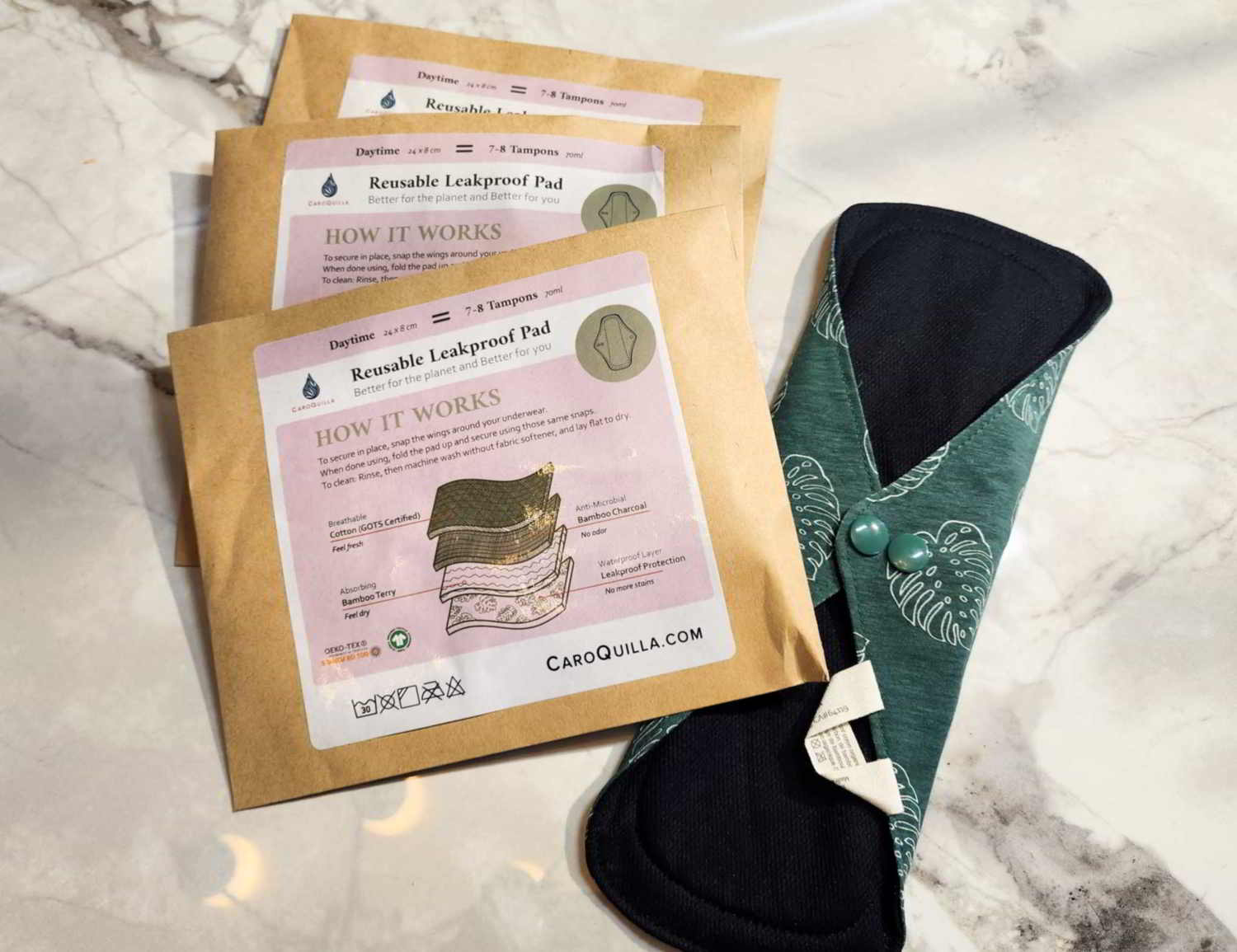 three daytime bamboo reusable pads and one out of package