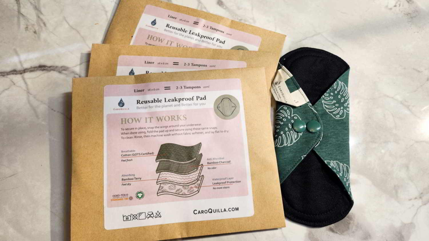 three bamboo reusable pads and one out of the package