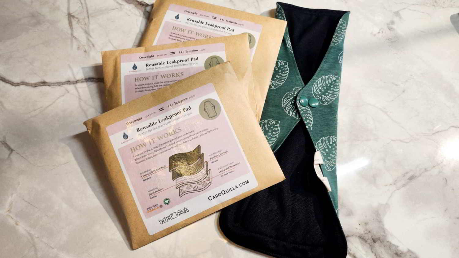 three bamboo reusable pads and one out of its packaging for size reference