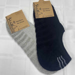 black and grey no show socks in packaging