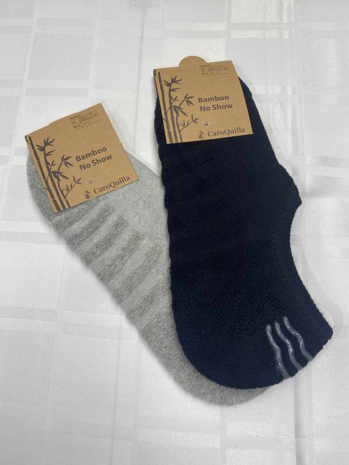 black and grey no show socks in packaging