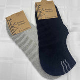 black and grey no show socks in packaging