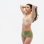 sage green breathable high rise briefs paired with padded bra in beige