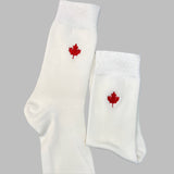 White mid calf pair of socks with red maple leaf design
