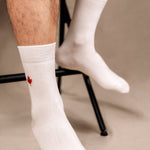unisex white bamboo socks with a red maple leaf design