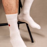 unisex white bamboo socks with a red maple leaf design