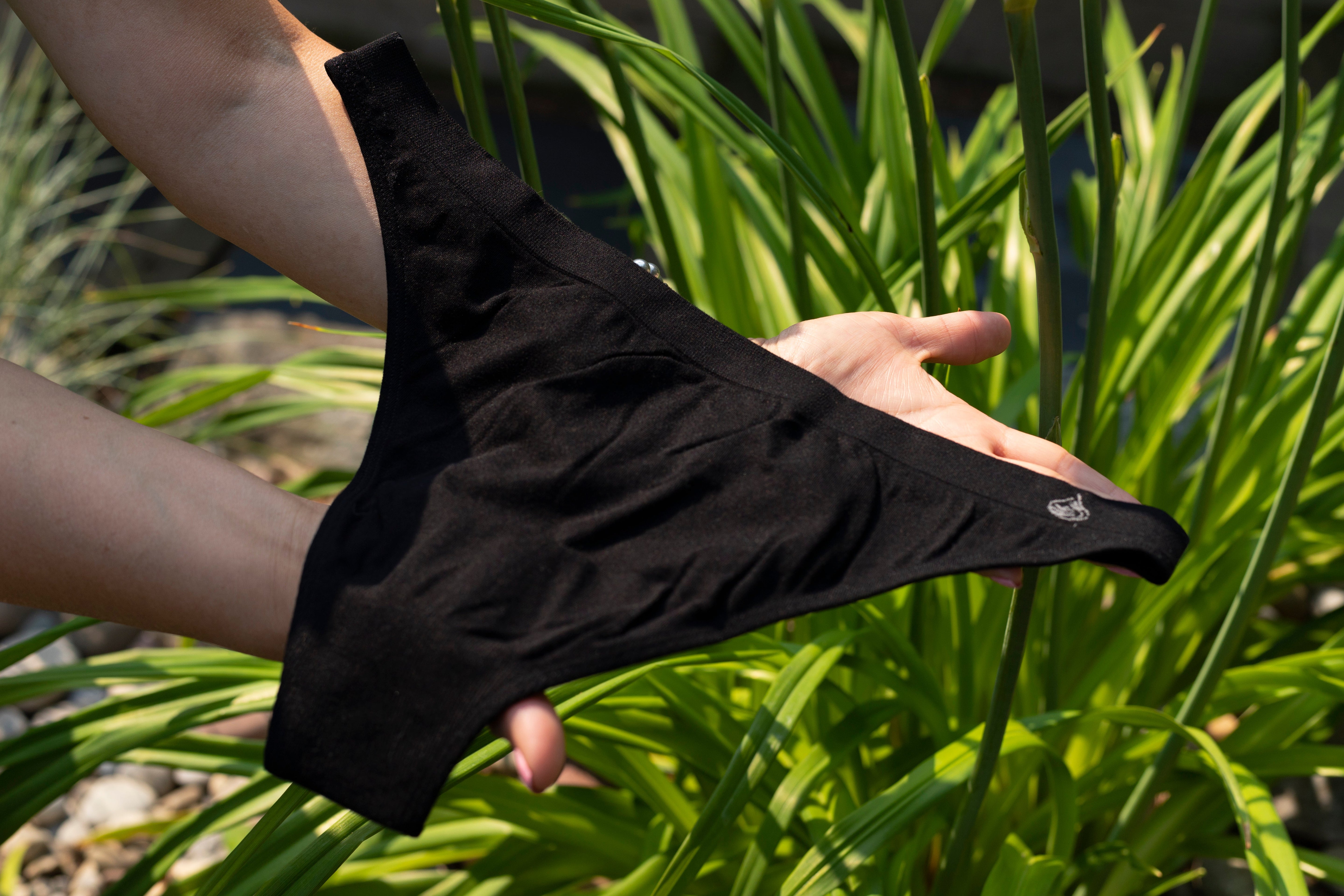 Woman holding a bamboo underwear