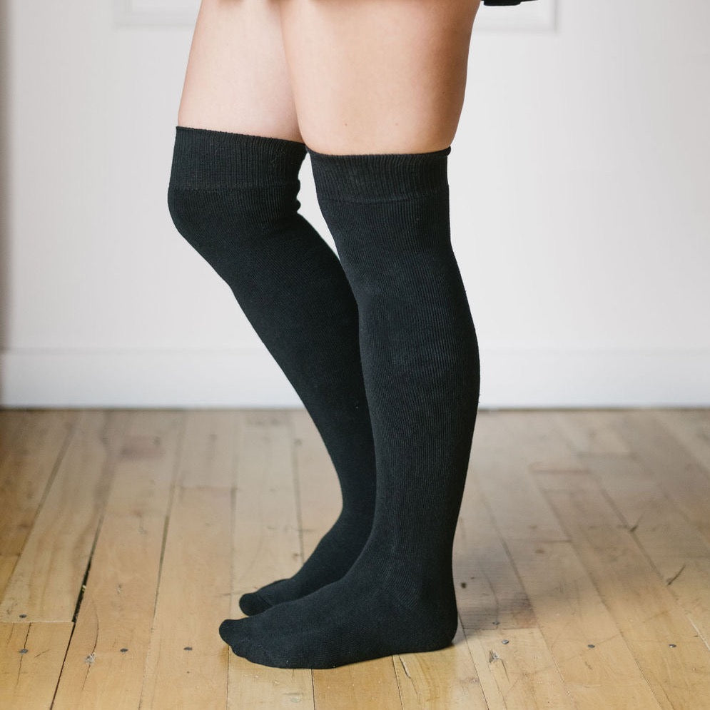 black bamboo knee high socks being worn side view 