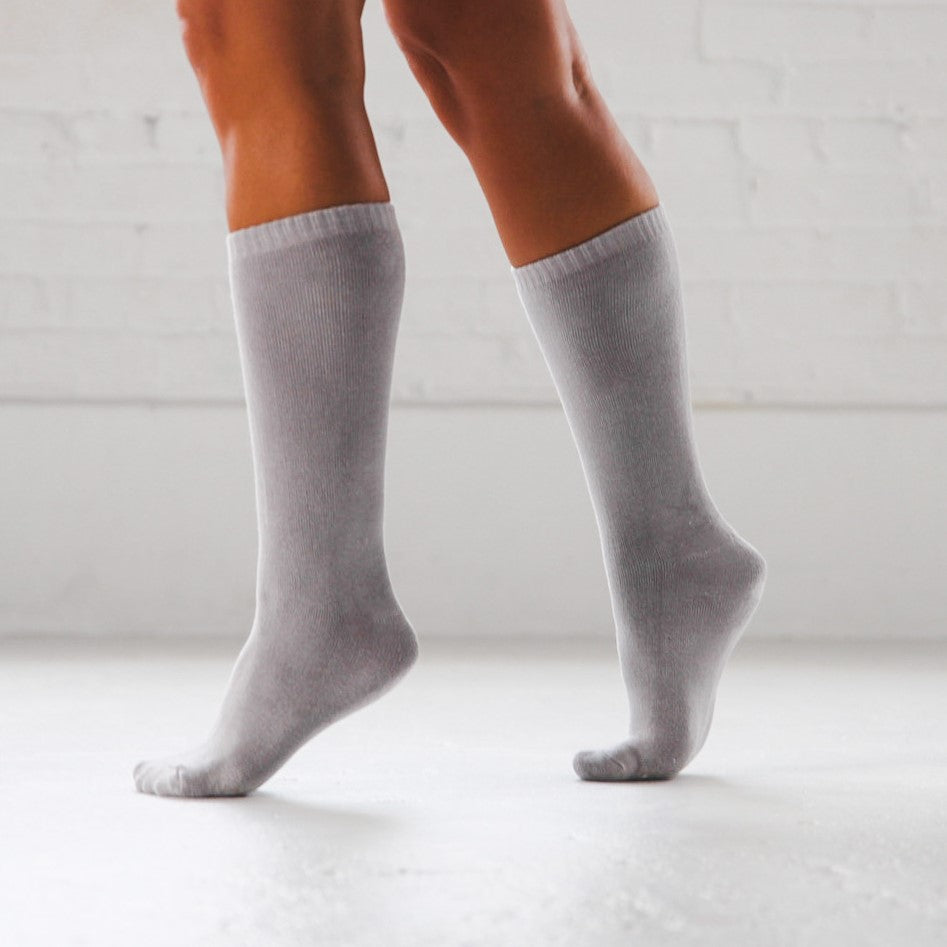 A person wearing grey chunky boot bamboo socks 