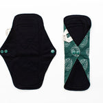 image displays the daytime reusable bamboo pad being unbuttoned and buttoned up 