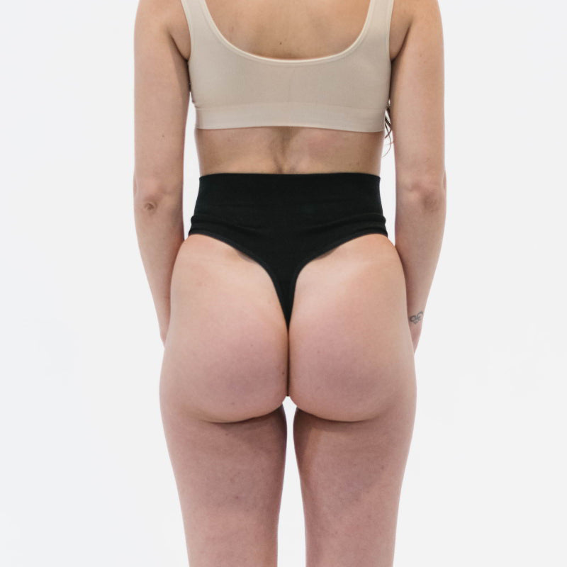 tummy hugging bamboo thong in black -back view 