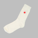 White bamboo sock with a red maple leaf design 