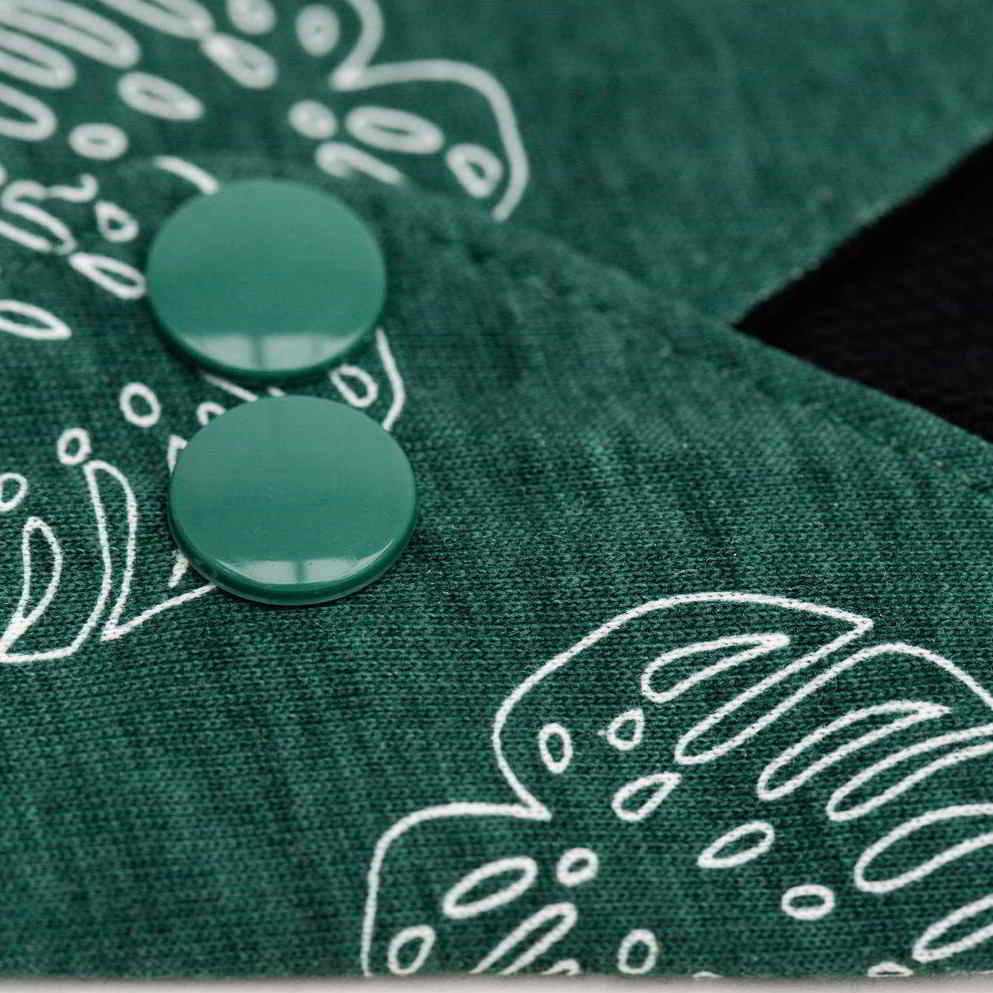 closeup on button closure of reusable pad